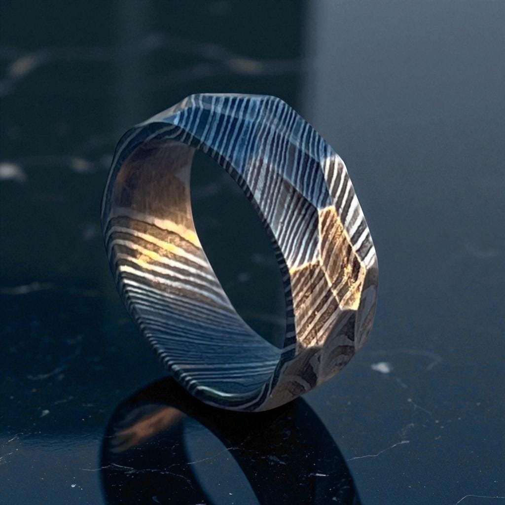 Metallic ring with a textured surface on a reflective dark surface