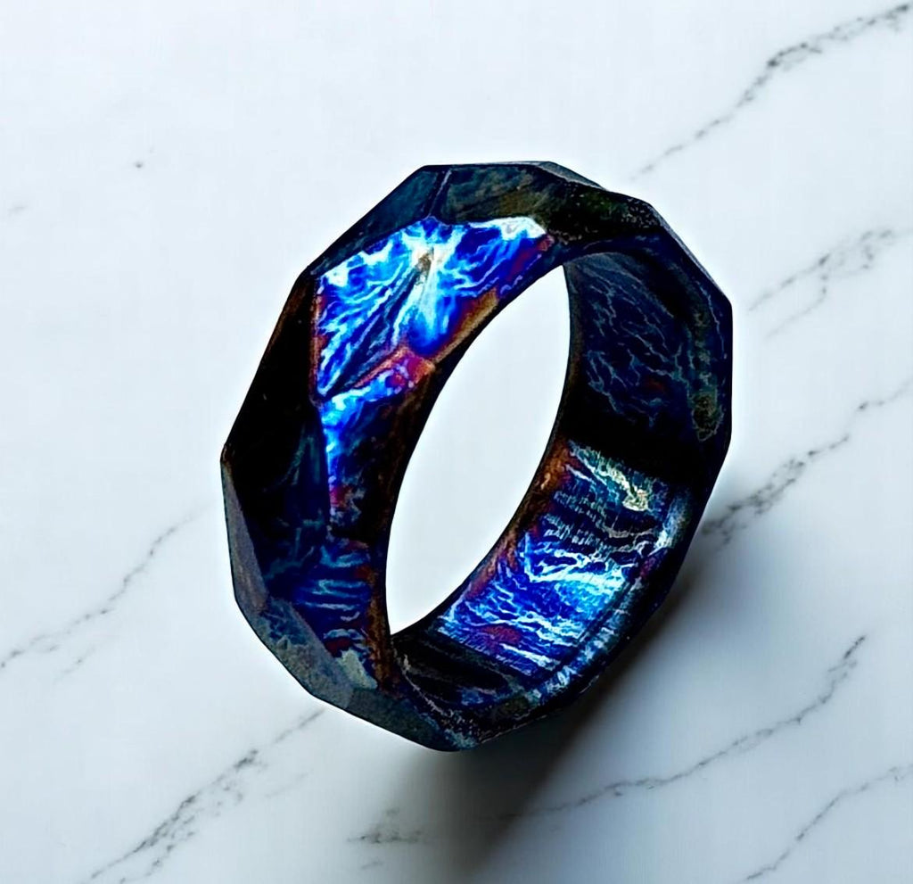 Multicolored ring with a marbled pattern on a marble surface