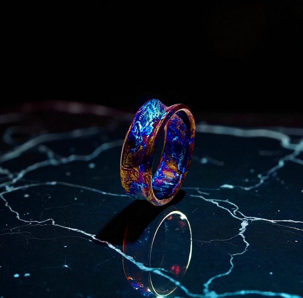 Glowing ring on a reflective surface with a dark background